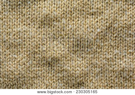 Knit Texture of Beige Wool Knitted Fabric with Regular Pattern. Knit Sweater Blank Background