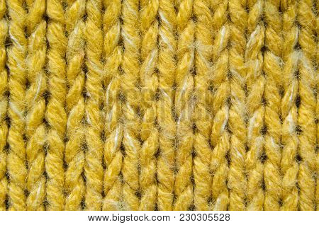 Yellow Knit Texture Close-Up. Knit Sweater Blank Background