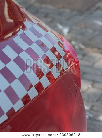 Red Sports Car With White And Red Chest Decoration