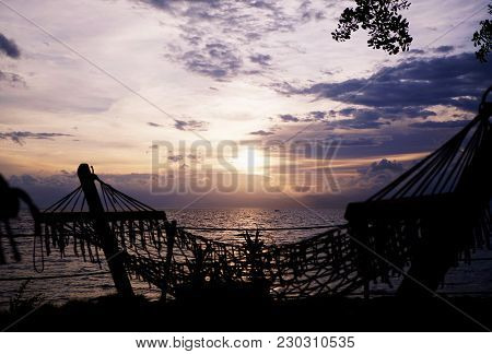 Hammock Next To The Beach With Sunset