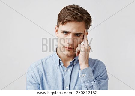 Portrait Of Young Man Who Is Looking Very Concerned. Best Friend Of This Guy Is Having A Birthday To