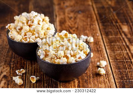 Two Exquisite Ceramic Bowls With Fresh Popcorn. Still-life On A Wooden Background.