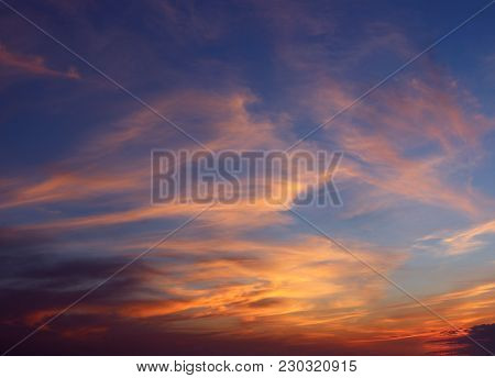 Whisps Of Clouds In A Cotton Candy Sky At Sunset.