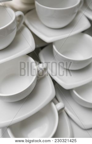 Many Rows Clean White Coffee Cup, Tea Spoon And Saucer On Table. Empty Mug Set In Row Prepare For Co