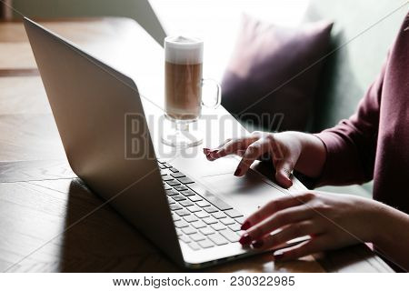 Female Working On Laptop In A Cafe. Woman Using Laptop In Home. Using Laptop Internet. Hand Using La