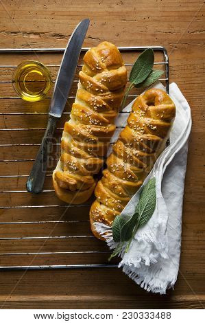 Freshly Baked Salty Braided Bread Loaf On A Baking Sheet