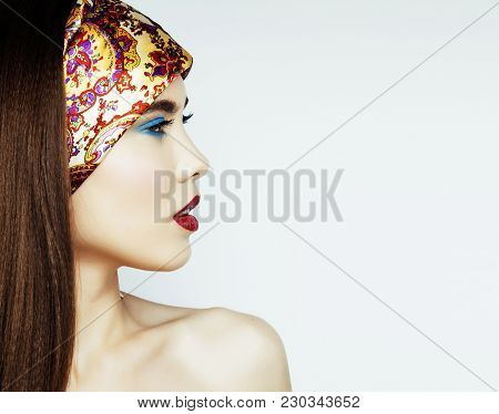 Young Pretty Modern Girl With Bright Shawl On Head Emotional Posing Isolated On White Background, As