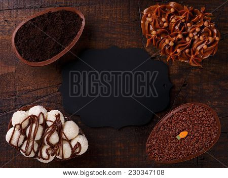 Chocolate Egg Ith Filling For Easter On Wooden Background