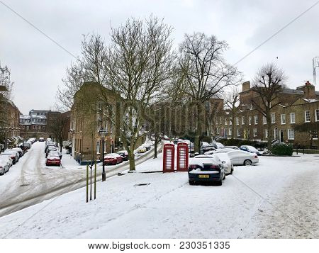 HAMPSTEAD, LONDON - MARCH 1, 2018: Two red public telephone boxes in Hampstead, North London, UK.