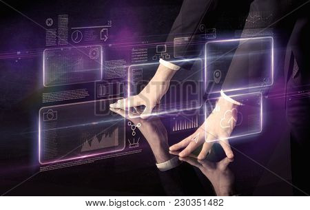 Male hands touching interactive table with purple cloudspace graphic on it 