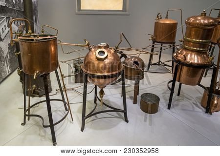 Paris, France, March 27 2017: Hall presentations perfume of the Museum Fragonard Distiller for the production of perfume water, the copper metal vat, a museum piece