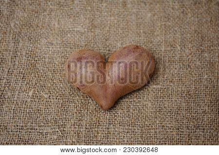 Potatoes In The Form Of Heart On Sacking Closeup