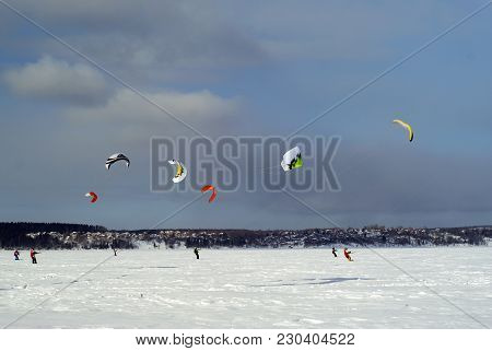 Perm, Russia - March 09, 2018: Snow Kiters Glides On The Ice Of The Kama Reservoir