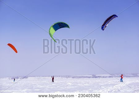 Perm, Russia - March 09, 2018: Snow Kiters Glides On The Ice Of The Kama Reservoir