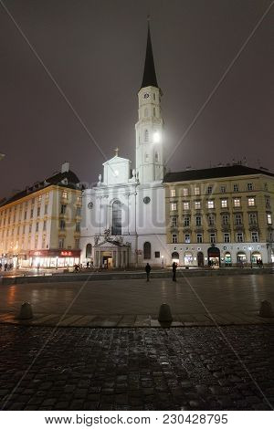 Vienna, Austria - January 8, 2014: St Michael Church At Michaelerplatz In Vienna, Austria. People On