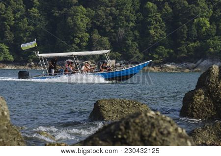 Pangkor Island, Malaysia - 17 December 2017 : Group Of Tourist Enjoy Exploring Pangkor Island Locate