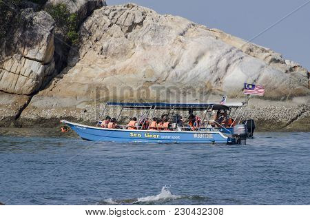Pangkor Island, Malaysia - 17 December 2017 : Group Of Tourist Enjoy Exploring Pangkor Island Locate