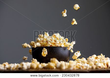 Levitating Falling Popcorn In A Ceramic Bowl And Around It.