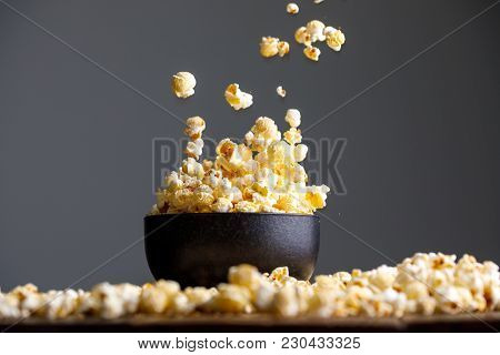 Levitating Falling Popcorn In A Ceramic Cup And Around It.