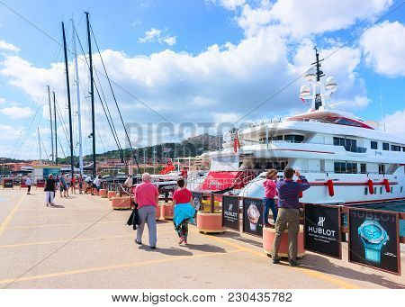 Porto Cervo, Italy - September 11, 2017: People On Embankment With Yachts At Porto Cervo, Costa Esme