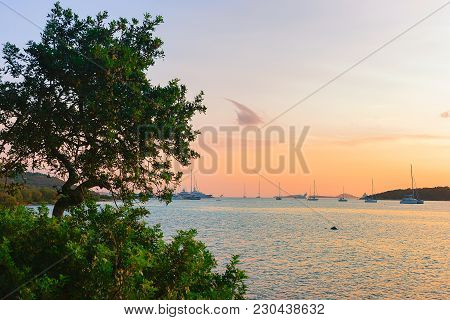 Sunrise With Yachts And Ships At Porto Rotondo On Costa Smeralda At Mediterranean Sea, Sardinia, Ita