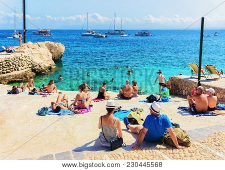 Scopello, Italy - September 17, 2017: People Relaxing At The Beach In Scopello, Castellammare Del Go