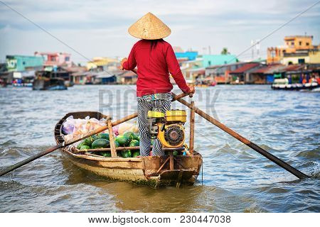 Woman In A Boat Selling Watermelon At The Floating Market At The Delta Mekong In Can Tho, Vietnam