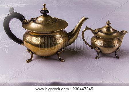 Elegant Silver Set For Coffee Or Tea On The Table With White Tablecloth, Close Up.