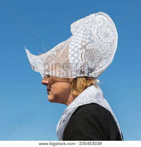 Urk, The Netherlands - September 02, 2017: Woman With Traditional Clothing And Headgear At A Local F