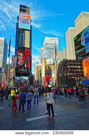 New York, Usa - April 25, 2015: Pedestrians On 7th Avenue And Broadway In Times Square. Skyscrapers 