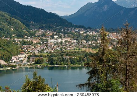 Aerial View Of The Small Town Of Levico Terme With The Lake And The Mountains. Trentino Alto Adige, 