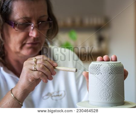Herend, Veszprem / Hungary - August 03, 2012 - A Herend Porcelain Maker Demonstrates How To Make Her