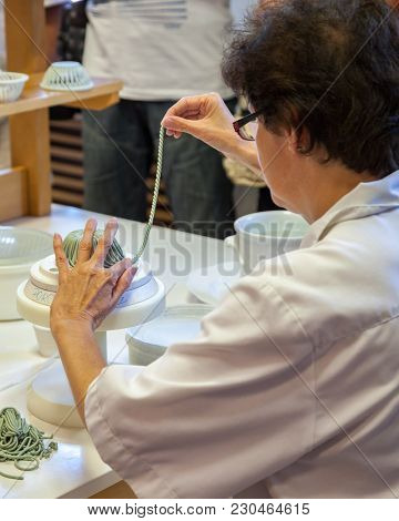 Herend, Veszprem / Hungary - August 03, 2012 - A Herend Porcelain Maker Demonstrates How To Make Her