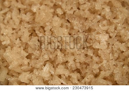 Closeup Background Of Brown Salt Crystals In A Heap.