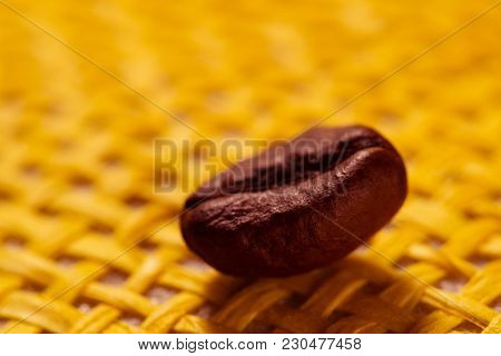 Roasted, Fragrant Coffee Grains Macro Delicious Beverage On Yellow Background