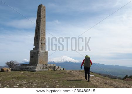 man with backpack going to Nelson Obelisk in Nebrodi Park, Sicily