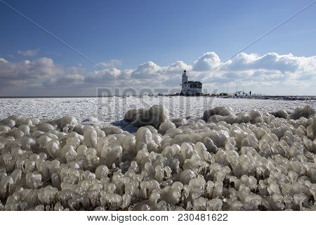 The Island Of Marken In Winter With Lighthouse And Ice Sculptures