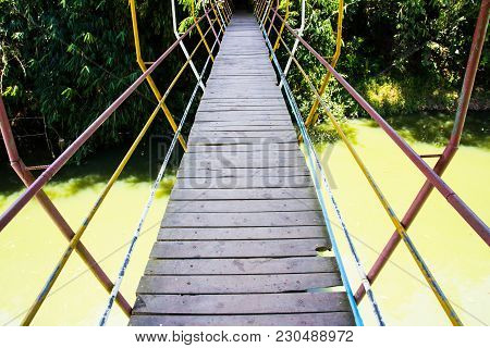 Close Up Suspension Bridge Across A River