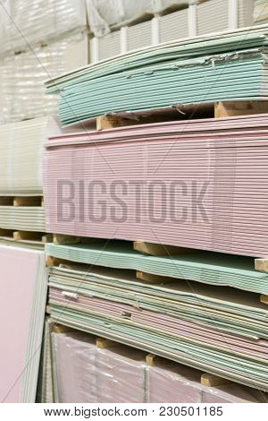 Warehouse With Plasterboard. Sheets Of Plasterboard On Pallets