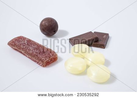 Candies And Chololate In A White Background Composition
