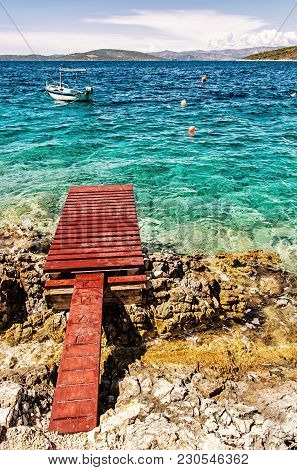Beautiful Mediterranean Sea, Solta, Croatia. Summer Vacation. Springboard, Turquoise Water And Littl