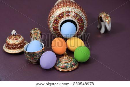 Colorful Ester Eggs With Traditional Thai Five-colored Vase (benjarong)
