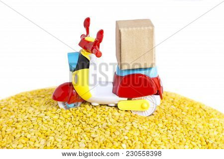 Colorful Motorcycle With Delivery Boxes And A Lot Of Yellow Split Mung Dal Or Moong Dal Pile On The 