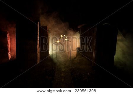 Empty Street Of Burnt Up City, Flames On The Ground And Blasts With Smoke In The Distance. Apocalypt