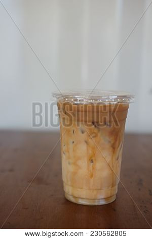 Iced Caramel Macciato Coffee With Milk In Glass. Cold Sweet Refreshing Summer Drink Concept