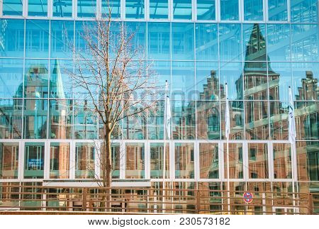 Reflections Of Speherstadt In Hafencity Hamburg In Modern Buildings.