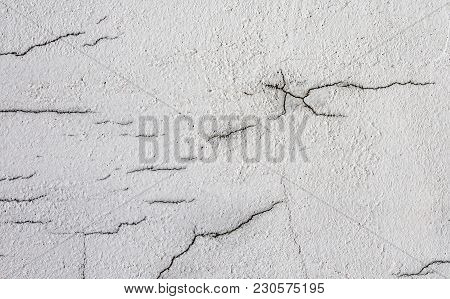 Texture Of White Dirty Cracked Wall. Small Straight Cracks. Direct Fracture On Painted Surface. Cell