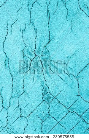 Texture Of White Blue Cracked Wall. Small Straight Cracks. Direct Fracture On Painted Surface. Cells