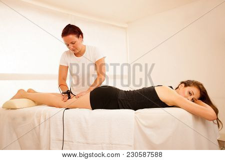 Physiotherapist Doing Tecar Therapy Alterantive Treatment On A Woman Patient
