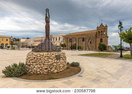 Zakynthos, Greece - September 29, 2017: Statue Of Liberty And Ancient Church Of St. Nicholas Of The 